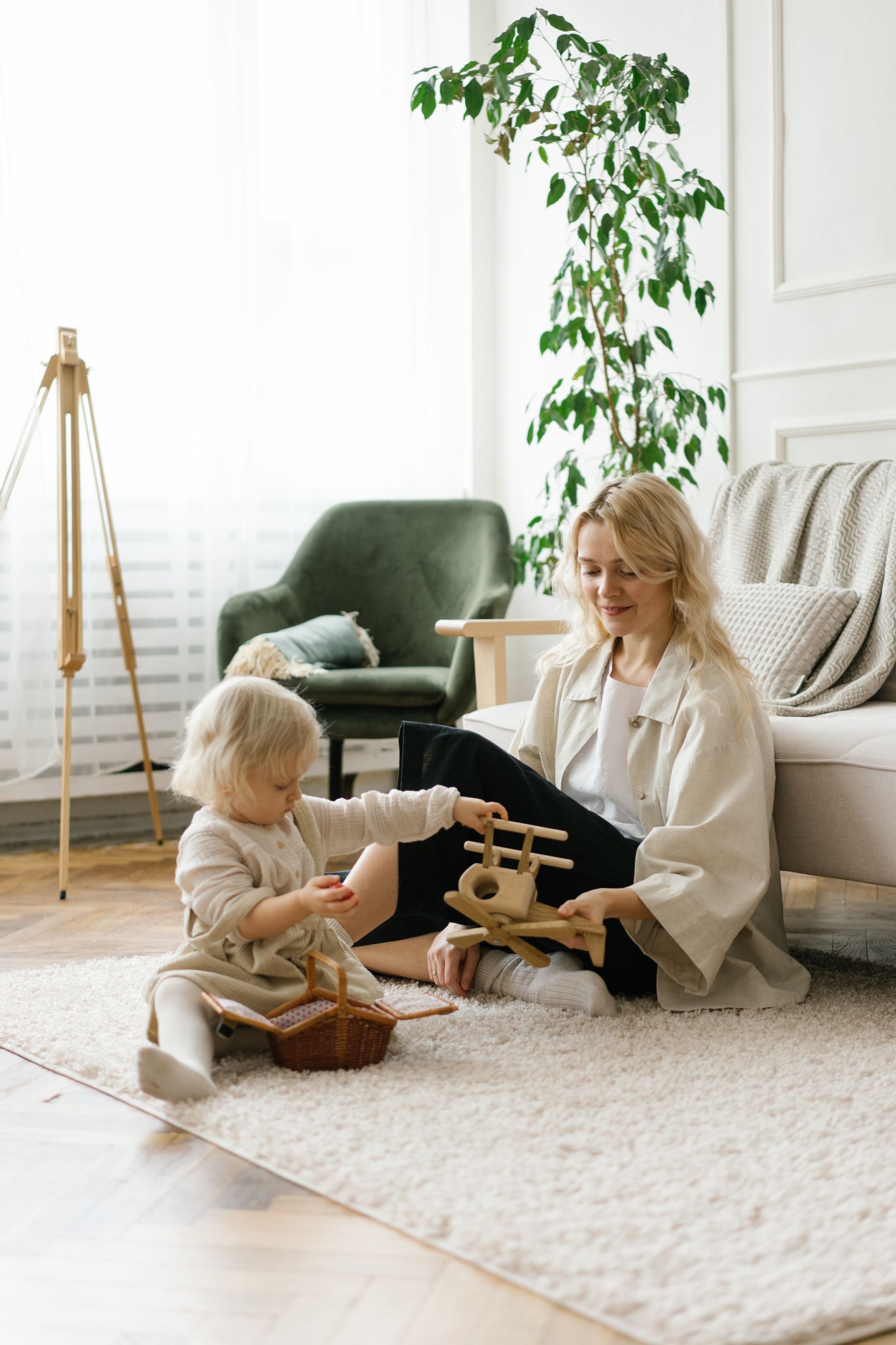 A mother and toddler playing together at home